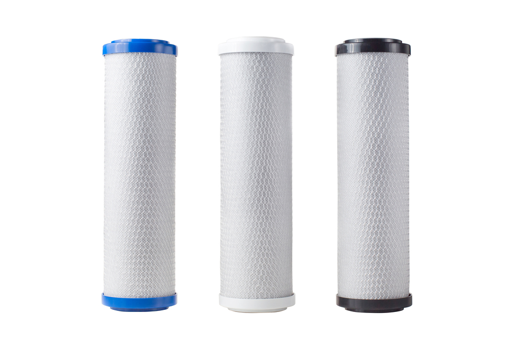 A set of water filter cartridges in various sizes and colors